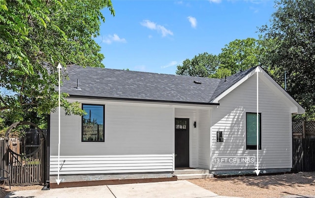 2216 Lindell Ave Unit 2, Austin, TX 78704 - view of front of home featuring a shingled roof and a gate