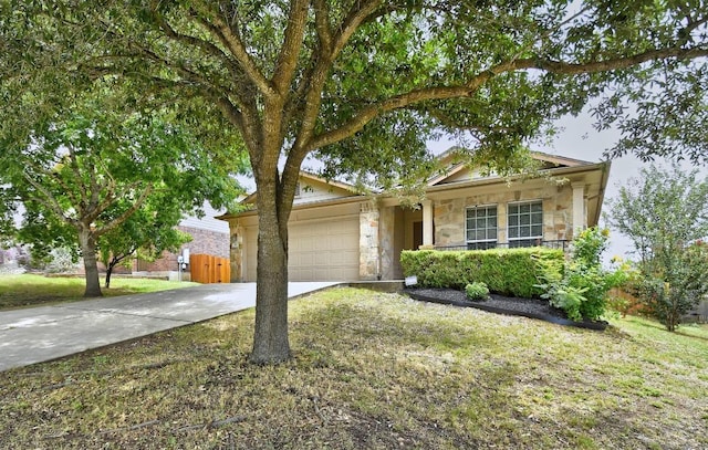 371 Bloomsbury Dr, Kyle, TX 78640 - single story home with stone siding, concrete driveway, and an attached garage