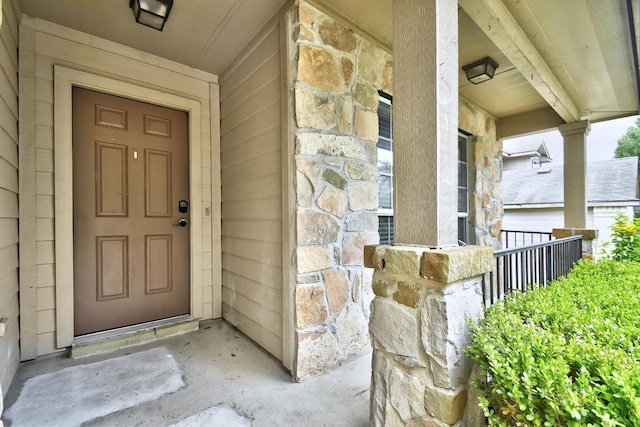 371 Bloomsbury Dr, Kyle, TX 78640 - property entrance featuring stone siding and a porch