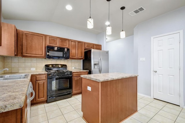 371 Bloomsbury Dr, Kyle, TX 78640 - kitchen featuring black appliances, light tile patterned flooring, backsplash, light countertops, and lofted ceiling