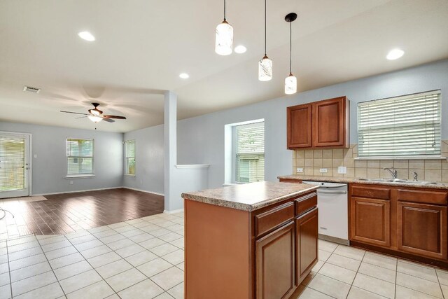 371 Bloomsbury Dr, Kyle, TX 78640 - kitchen featuring dishwasher, healthy amount of natural light, a ceiling fan, light tile patterned floors, and recessed lighting