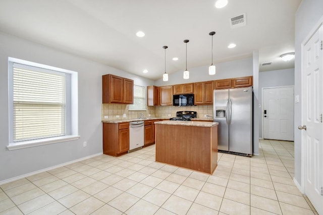 371 Bloomsbury Dr, Kyle, TX 78640 - kitchen with stainless steel fridge, black microwave, stove, dishwashing machine, and backsplash