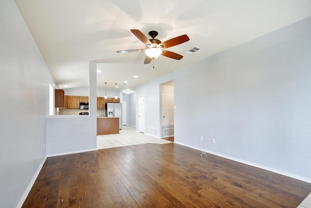 371 Bloomsbury Dr, Kyle, TX 78640 - unfurnished living room with ceiling fan, light wood finished floors, and recessed lighting
