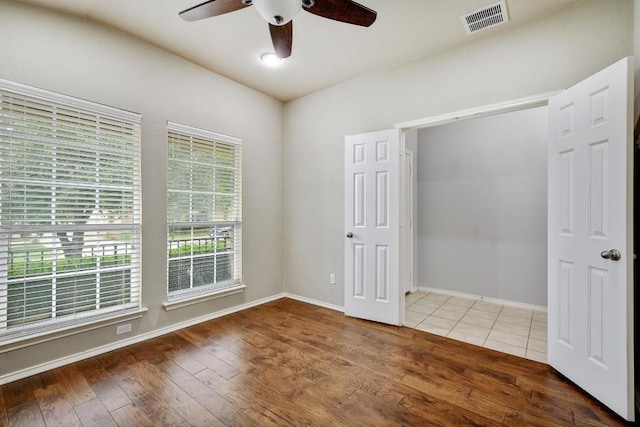 371 Bloomsbury Dr, Kyle, TX 78640 - unfurnished bedroom with hardwood / wood-style floors and a ceiling fan