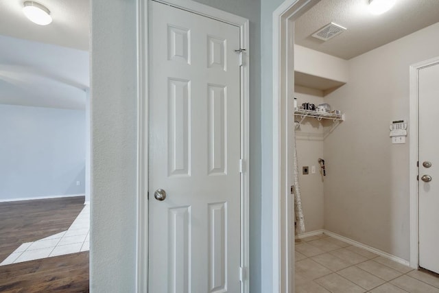 371 Bloomsbury Dr, Kyle, TX 78640 - washroom with electric dryer hookup and light tile patterned floors