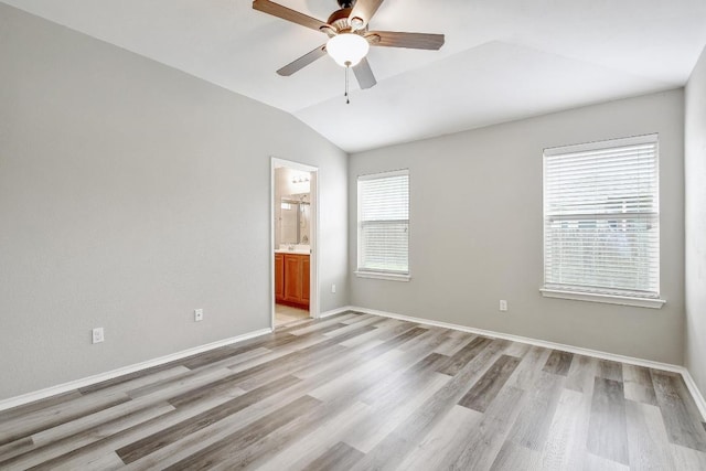 371 Bloomsbury Dr, Kyle, TX 78640 - unfurnished room with light wood-style flooring, vaulted ceiling, and a ceiling fan