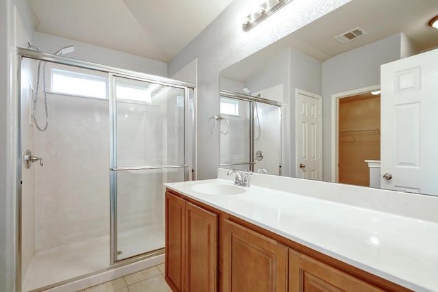 371 Bloomsbury Dr, Kyle, TX 78640 - full bathroom with plenty of natural light, a shower stall, vanity, and a spacious closet