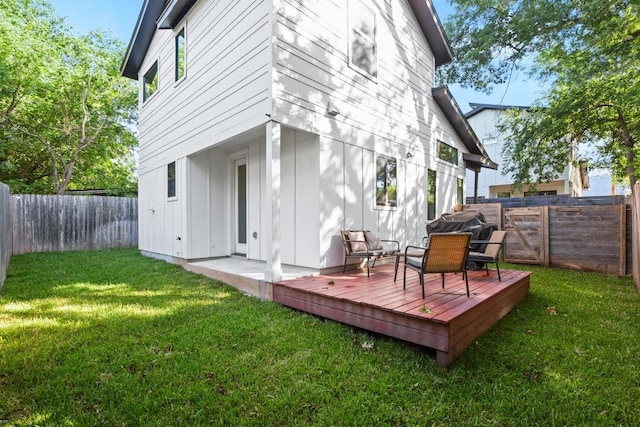619 Hammack Dr Unit 2, Austin, TX 78752 - rear view of house featuring a wooden deck, a fenced backyard, and board and batten siding