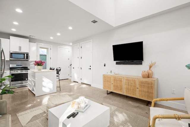 619 Hammack Dr Unit 2, Austin, TX 78752 - living room featuring recessed lighting and concrete floors