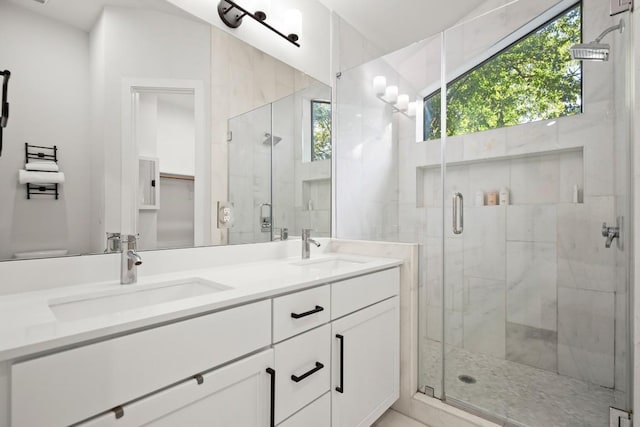 619 Hammack Dr Unit 2, Austin, TX 78752 - full bathroom featuring healthy amount of natural light, double vanity, and a stall shower
