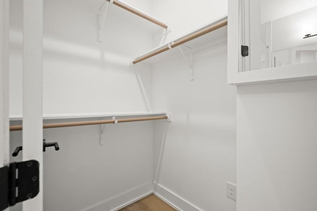 619 Hammack Dr Unit 2, Austin, TX 78752 - walk in closet with wood finished floors