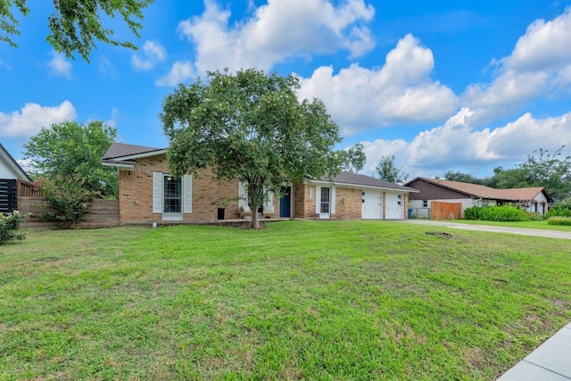 409 White Wing Way, Round Rock, TX 78664 - ranch-style home featuring brick siding, concrete driveway, and a garage