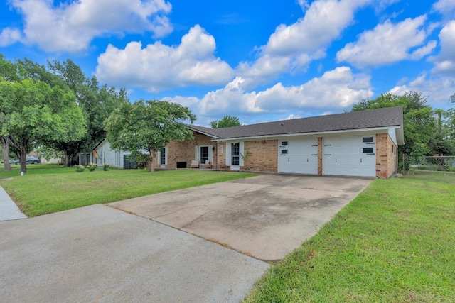 409 White Wing Way, Round Rock, TX 78664 - single story home with driveway, brick siding, and a garage