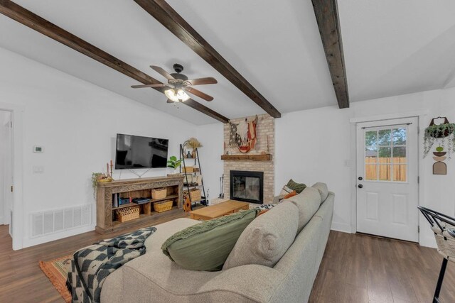 409 White Wing Way, Round Rock, TX 78664 - living area with a fireplace, a ceiling fan, and wood finished floors