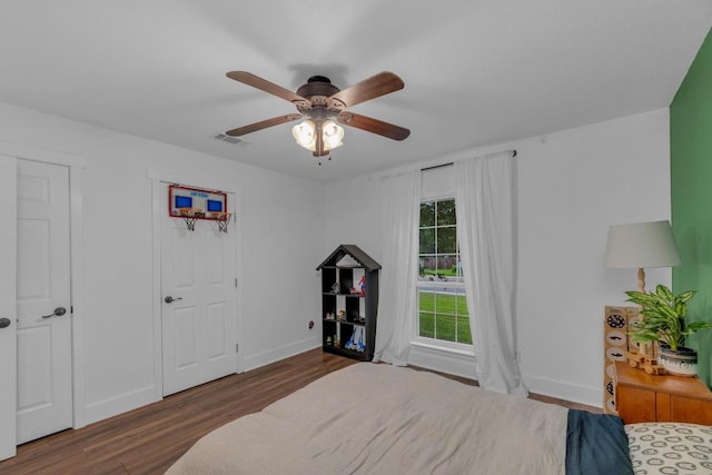 409 White Wing Way, Round Rock, TX 78664 - bedroom with wood finished floors and a ceiling fan