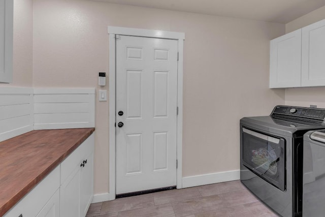 409 White Wing Way, Round Rock, TX 78664 - laundry room featuring cabinet space and independent washer and dryer