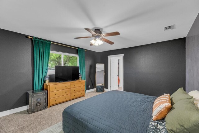 409 White Wing Way, Round Rock, TX 78664 - carpeted bedroom featuring a textured wall and ceiling fan
