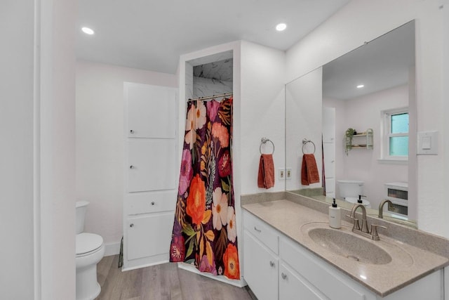 409 White Wing Way, Round Rock, TX 78664 - full bathroom featuring vanity, wood finished floors, a shower with shower curtain, and recessed lighting