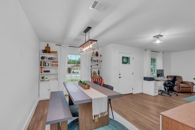 409 White Wing Way, Round Rock, TX 78664 - dining area with wood finished floors and an office area