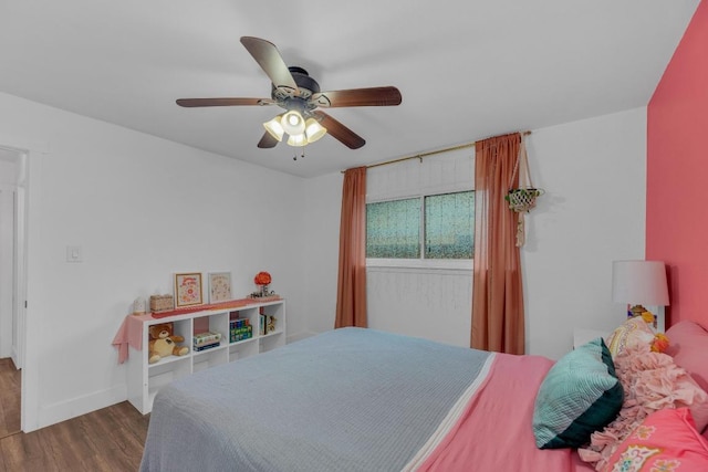 409 White Wing Way, Round Rock, TX 78664 - bedroom with wood finished floors and a ceiling fan