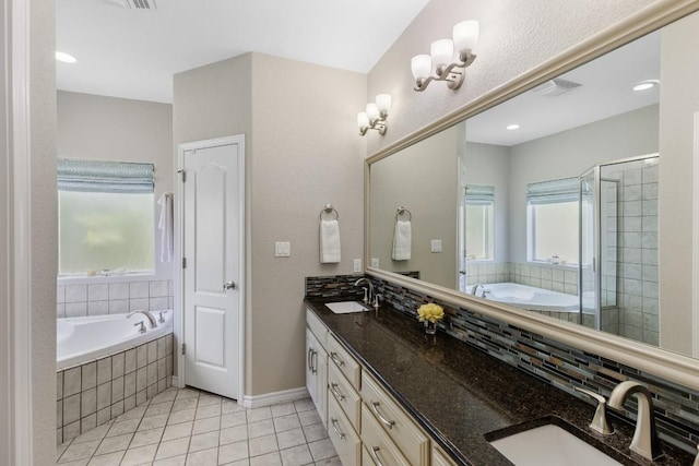 521 Lucy Ln, Horseshoe Bay, TX 78657 - full bath with double vanity, tile patterned floors, a bath, and a shower stall