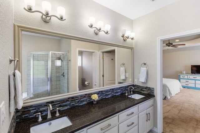 521 Lucy Ln, Horseshoe Bay, TX 78657 - full bath with double vanity, decorative backsplash, a shower stall, ensuite bath, and ceiling fan