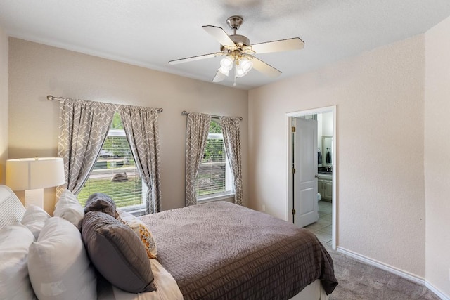 521 Lucy Ln, Horseshoe Bay, TX 78657 - bedroom featuring carpet flooring, a ceiling fan, and connected bathroom