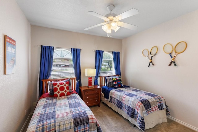 521 Lucy Ln, Horseshoe Bay, TX 78657 - bedroom featuring carpet floors and ceiling fan