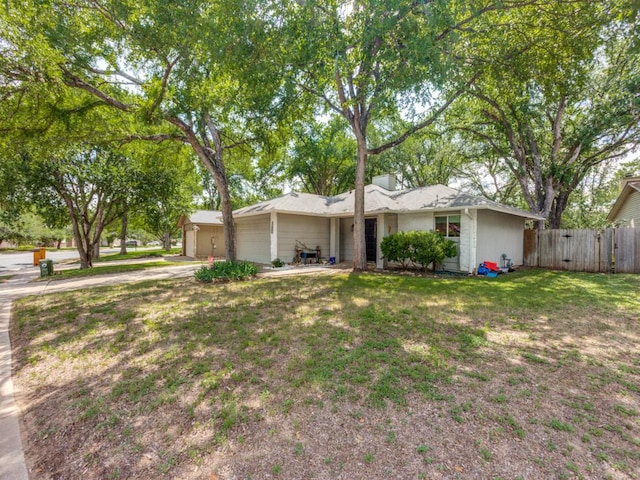 11405 Bristle Oak Trl, Austin, TX 78750 - view of front facade featuring a garage, concrete driveway, and a chimney