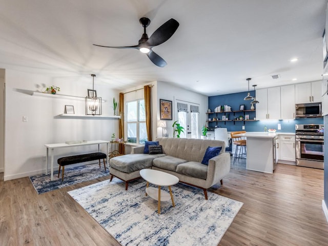 11405 Bristle Oak Trl, Austin, TX 78750 - living area with light wood-type flooring, a ceiling fan, recessed lighting, and a chandelier