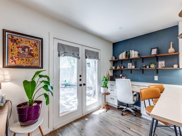11405 Bristle Oak Trl, Austin, TX 78750 - office area with french doors, built in desk, and light wood-style floors