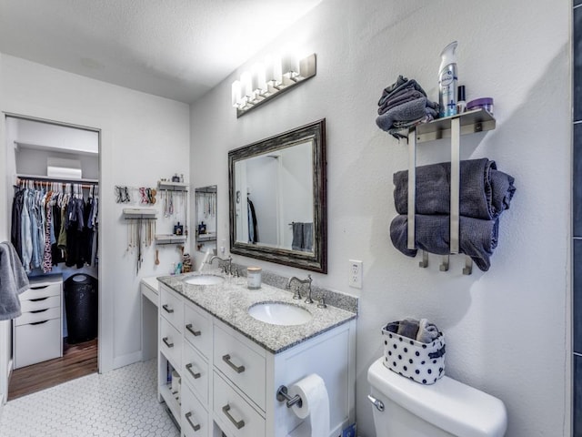 11405 Bristle Oak Trl, Austin, TX 78750 - bathroom with double vanity and a walk in closet