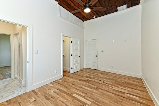 1104 E Salty St, Thorndale, TX 76577 - unfurnished bedroom with wood ceiling, a towering ceiling, and light wood-style floors