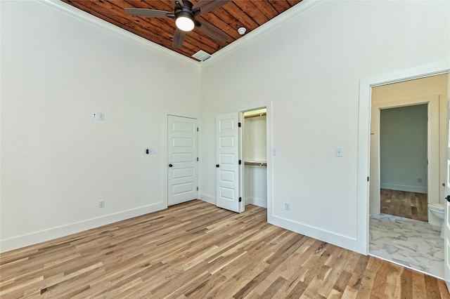 1104 E Salty St, Thorndale, TX 76577 - unfurnished bedroom with wood ceiling, light wood-type flooring, a towering ceiling, and crown molding