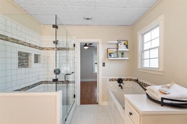 2206 Newfield Ln, Austin, TX 78703 - full bath with a shower stall, a bath, tile patterned floors, and a ceiling fan