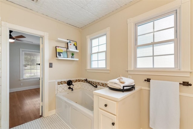 2206 Newfield Ln, Austin, TX 78703 - full bath featuring a jetted tub, ceiling fan, tile patterned floors, and crown molding