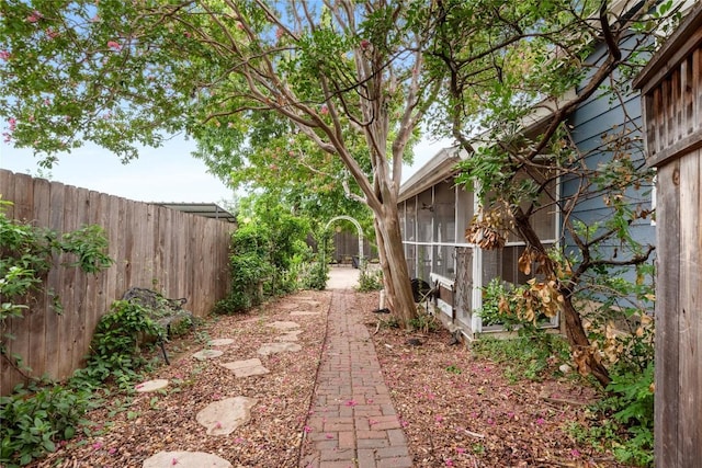 2206 Newfield Ln, Austin, TX 78703 - fenced backyard featuring a sunroom