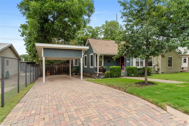 2206 Newfield Ln, Austin, TX 78703 - view of front of home featuring a carport, decorative driveway, and a porch