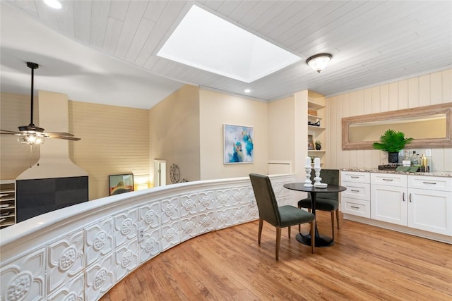 2206 Newfield Ln, Austin, TX 78703 - interior space featuring a ceiling fan, light wood finished floors, a skylight, and wood ceiling