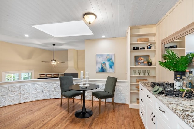 2206 Newfield Ln, Austin, TX 78703 - sitting room with a skylight, light wood-type flooring, wooden ceiling, ceiling fan, and built in features