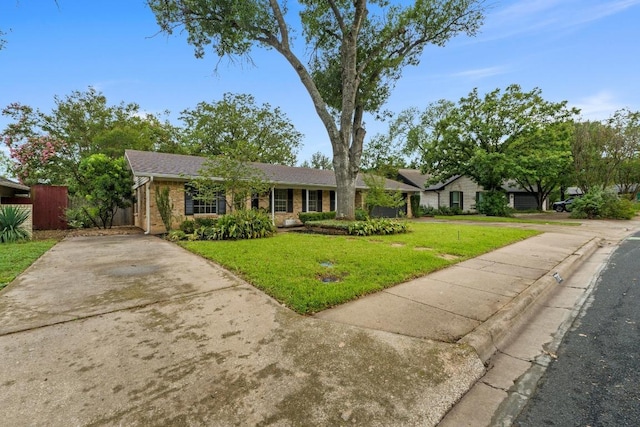 7710 Shoal Creek Blvd, Austin, TX 78757 - ranch-style house with brick siding and driveway