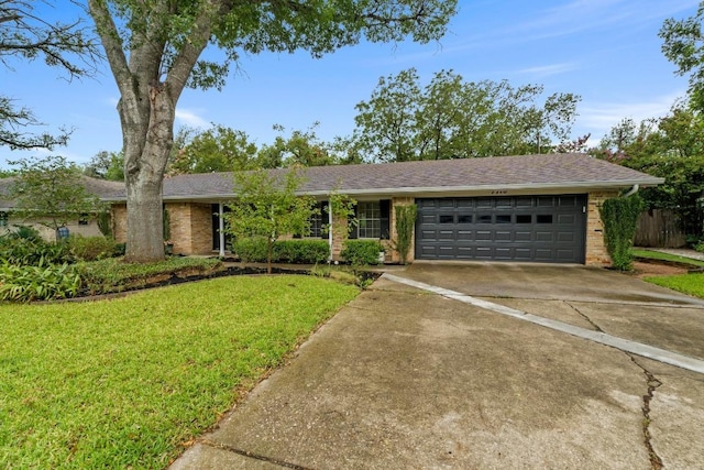 7710 Shoal Creek Blvd, Austin, TX 78757 - ranch-style house featuring concrete driveway, a garage, brick siding, and roof with shingles