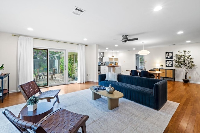 7710 Shoal Creek Blvd, Austin, TX 78757 - living room featuring recessed lighting, plenty of natural light, wood finished floors, and a ceiling fan