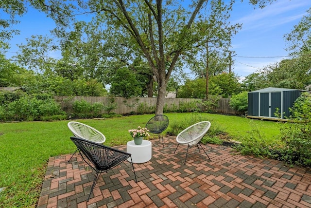 7710 Shoal Creek Blvd, Austin, TX 78757 - fenced backyard featuring a patio and a storage shed