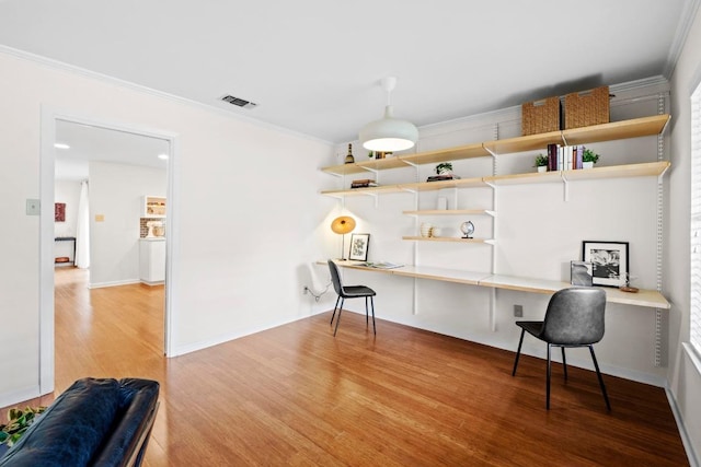 7710 Shoal Creek Blvd, Austin, TX 78757 - office area with wood finished floors and crown molding