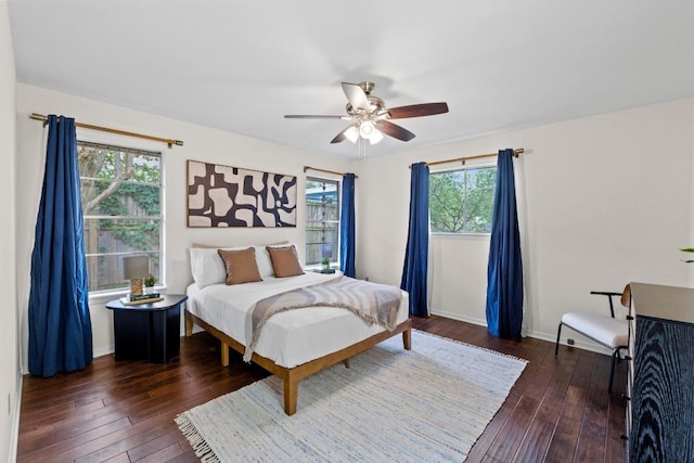 7710 Shoal Creek Blvd, Austin, TX 78757 - bedroom featuring dark wood-style floors and ceiling fan