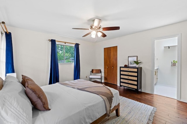 7710 Shoal Creek Blvd, Austin, TX 78757 - bedroom featuring hardwood / wood-style flooring, a ceiling fan, a closet, and connected bathroom