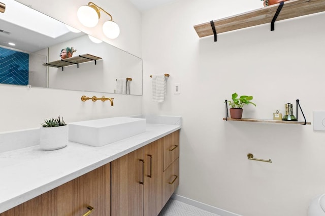 7710 Shoal Creek Blvd, Austin, TX 78757 - bathroom featuring vanity and baseboards