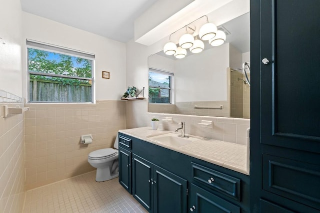 7710 Shoal Creek Blvd, Austin, TX 78757 - full bath with tile walls, plenty of natural light, tile patterned flooring, vanity, and a shower