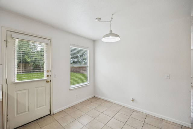 1444 Kenneys Way, Round Rock, TX 78665 - unfurnished dining area with baseboards and light tile patterned floors
